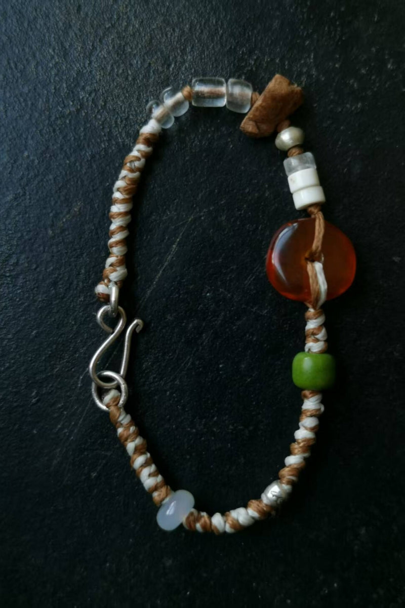 bracciale-corda-intrecciata-cachi-bianco-ambra-agata-ambra-gialla-argento-vista-frontale