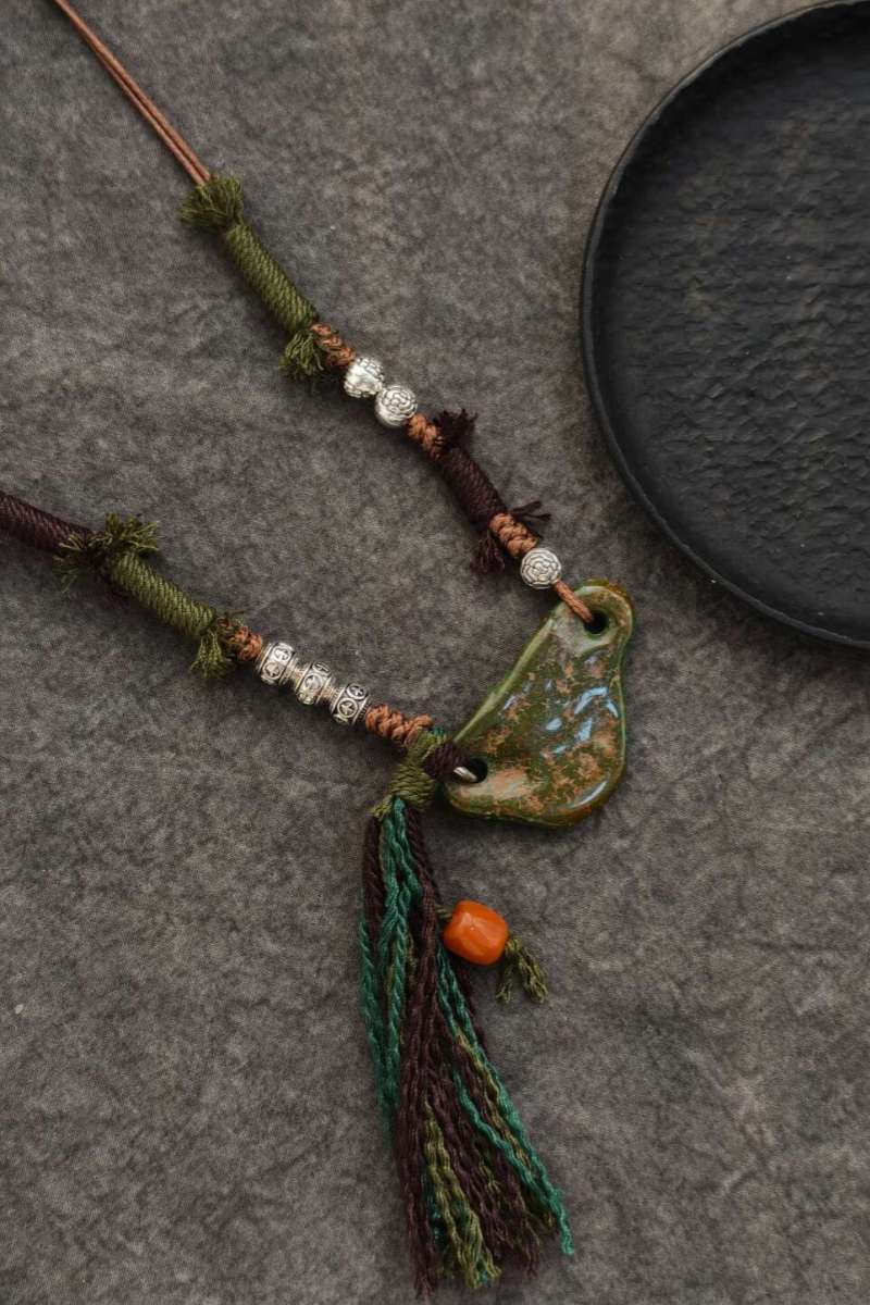 dettaglio-nappa-corda-intrecciata-grano-corallo-rosso-estremità